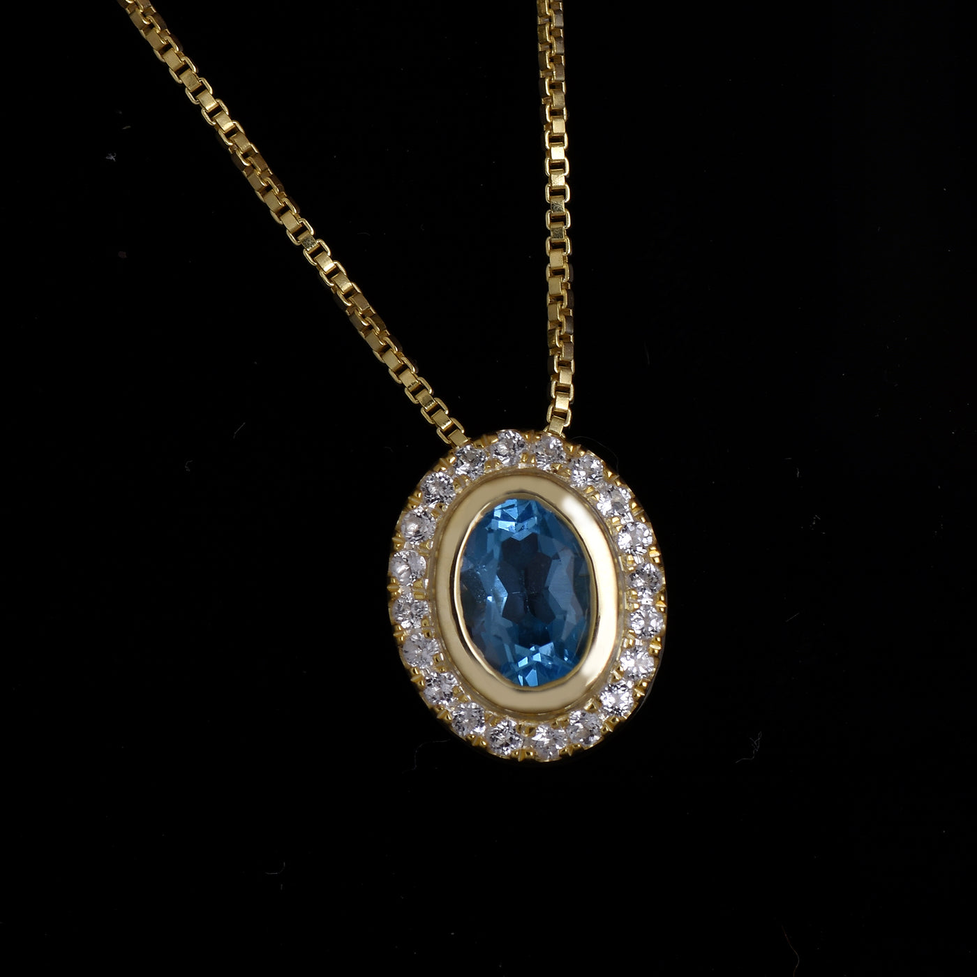 Oval Blue Topaz Halo Necklace