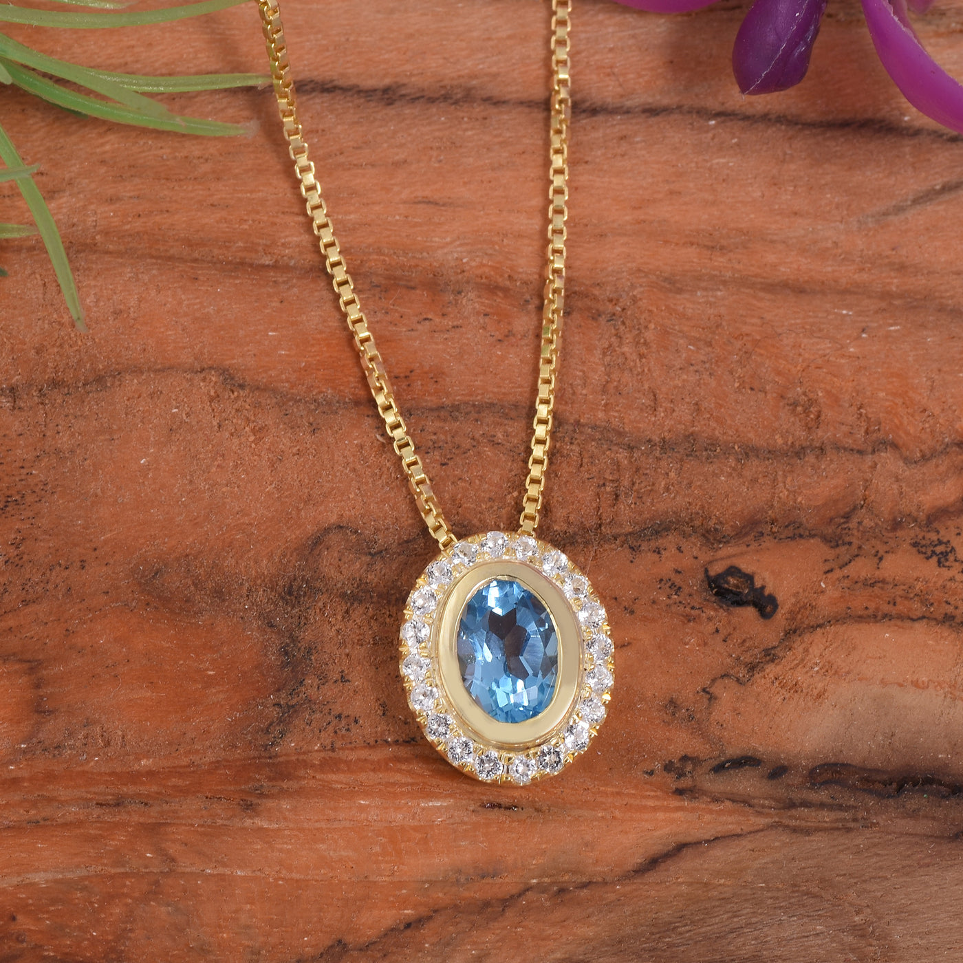 Oval Blue Topaz Halo Necklace