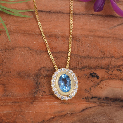 Oval Blue Topaz Halo Necklace